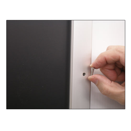 REMOVE SECURITY SCREWS FROM THE 48 x 60 FRAME PROFILE